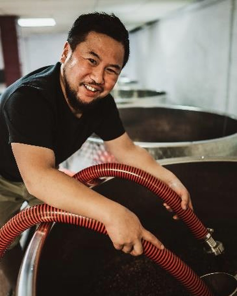 Hirotaka Ito, winemaker of Domaine Kuheiji, at work in the cellar in Morey-Saint-Denis.